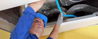 An images of a Vent Logistics employee installing a Fume Extraction system.